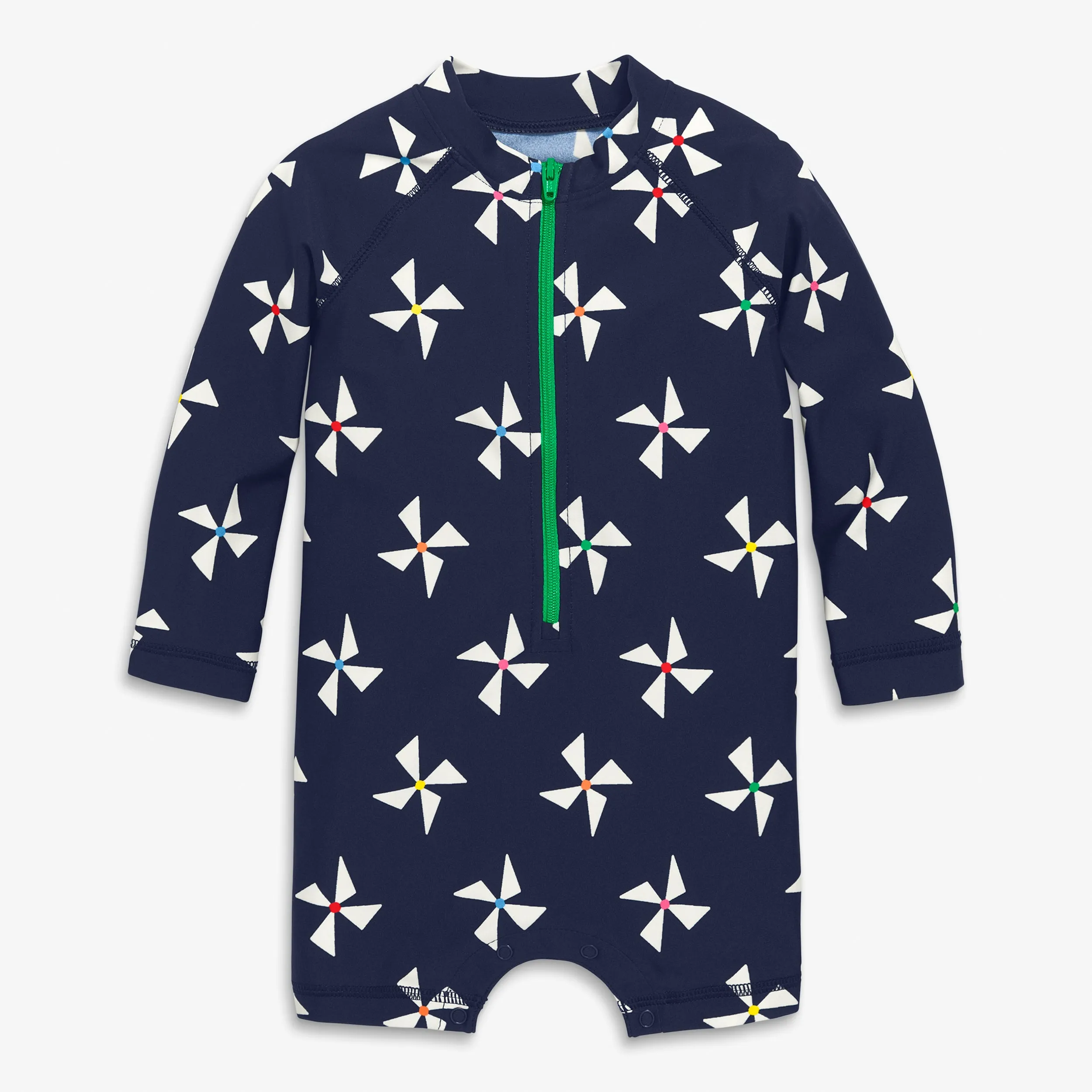 Baby one-piece rash guard in rainbow pinwheels